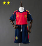Camiseta y Pantalones para niños España Home  2026/27 - Bicampeón del Mundo ⭐⭐
