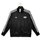 Abrigo Oasis x Adidas 2025