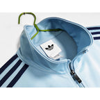 Abrigo Oasis x Adidas 2025